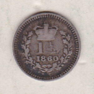 1860 Silver Three Halfpence coin features the portrait of Queen Victoria. The reverse has the crowned denomination above the date within an oak wreath.