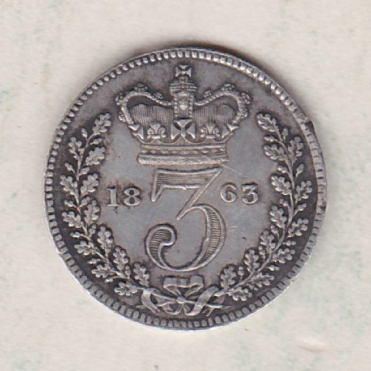 1863 Silver Threepence coin featuring the portrait of Queen Victoria on the Obverse. The Reverse features a crowned denomination dividing the date.