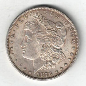 1878 Silver USA Morgan Dollar coin featuring lady liberty on the obverse. The eagle holding arrows and an olive branch on the reverse.