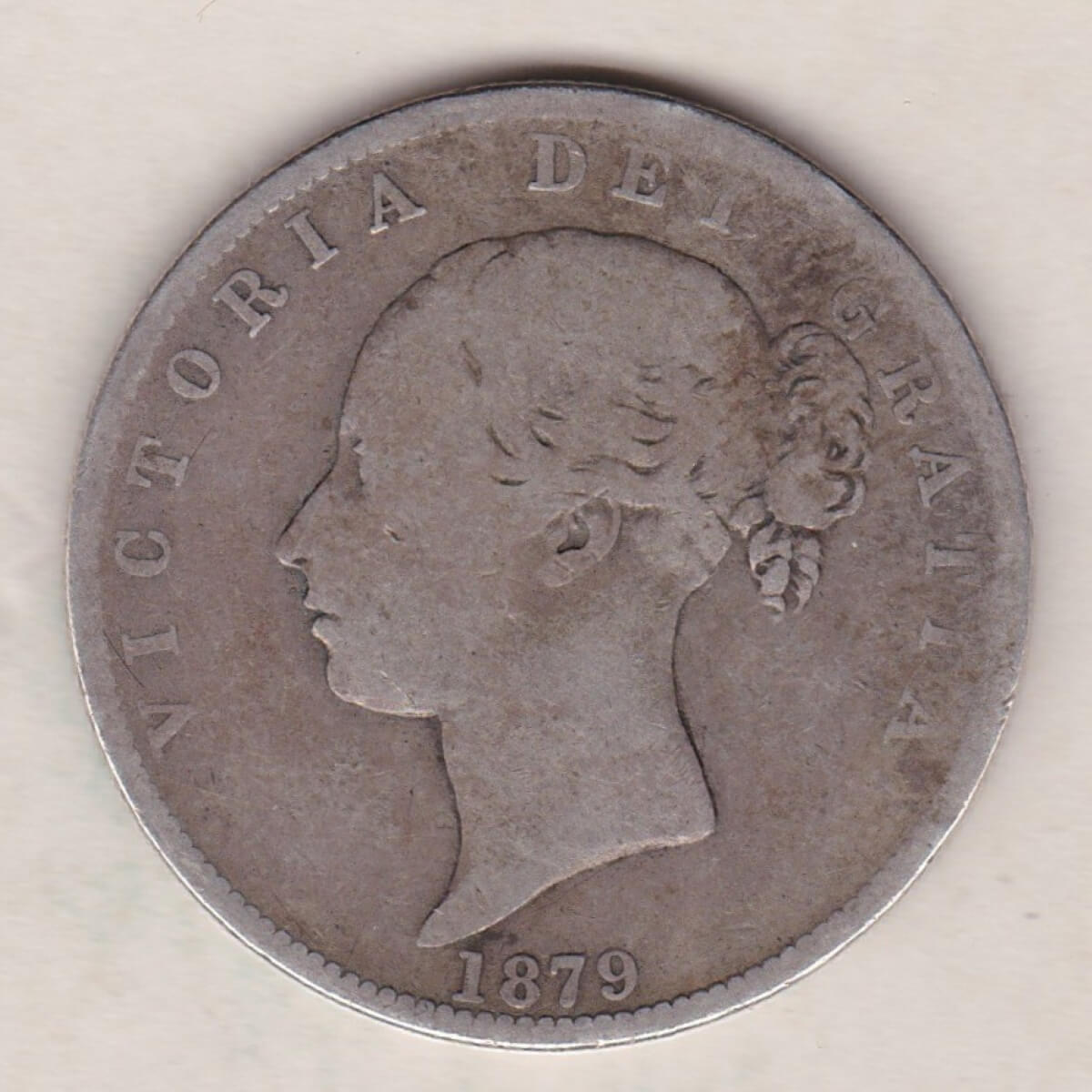 1879 Silver Halfcrown coin with young head Queen Victoria on the Obverse. Crowned square shield with laurel branches on the Reverse.