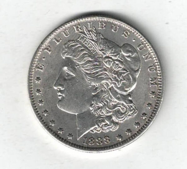 1888 O Silver USA Morgan Dollar coin featuring lady liberty on the obverse. The eagle holding arrows and an olive branch on the reverse.