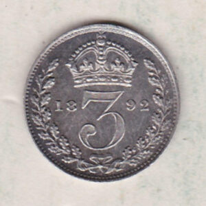 1892 Silver Maundy Threepence coin featuring Queen Victoria on the obverse. The reverse features a crowned denomination dividing date within an oak wreath. 