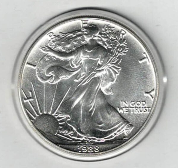 1988 Silver USA One Ounce Eagle. The liberty is on the obverse, The eagle is on the reverse. The coin contains one ounce of 999 fine silver.