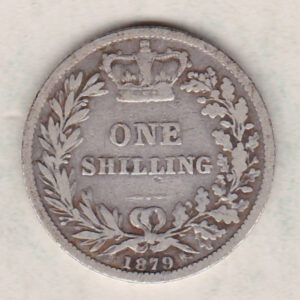 1879 silver shilling coin featuring Queen Victoria young head on the Obverse. The Reverse has a crown, laurel and oak leaves within an open wreath.