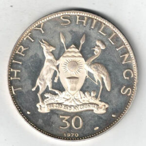 1970 Uganda Pope Paul VI Thirty Shillings Coin. The obverse features the coat of arms of Uganda. The reverse features the bust of Pope Paul Vi facing right.