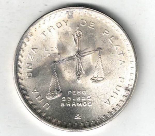 1979 Mexico One Ounce One Onza Coin. The reverse features a scale as a centre piece with legend and weight. All coins are in stock.