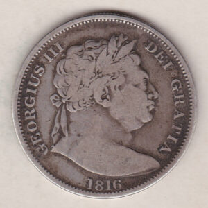 1816 Silver Halfcrown coin with King George III on the Obverse. The reverse features a a crowned Garter and ornate Royal shield of arms.
