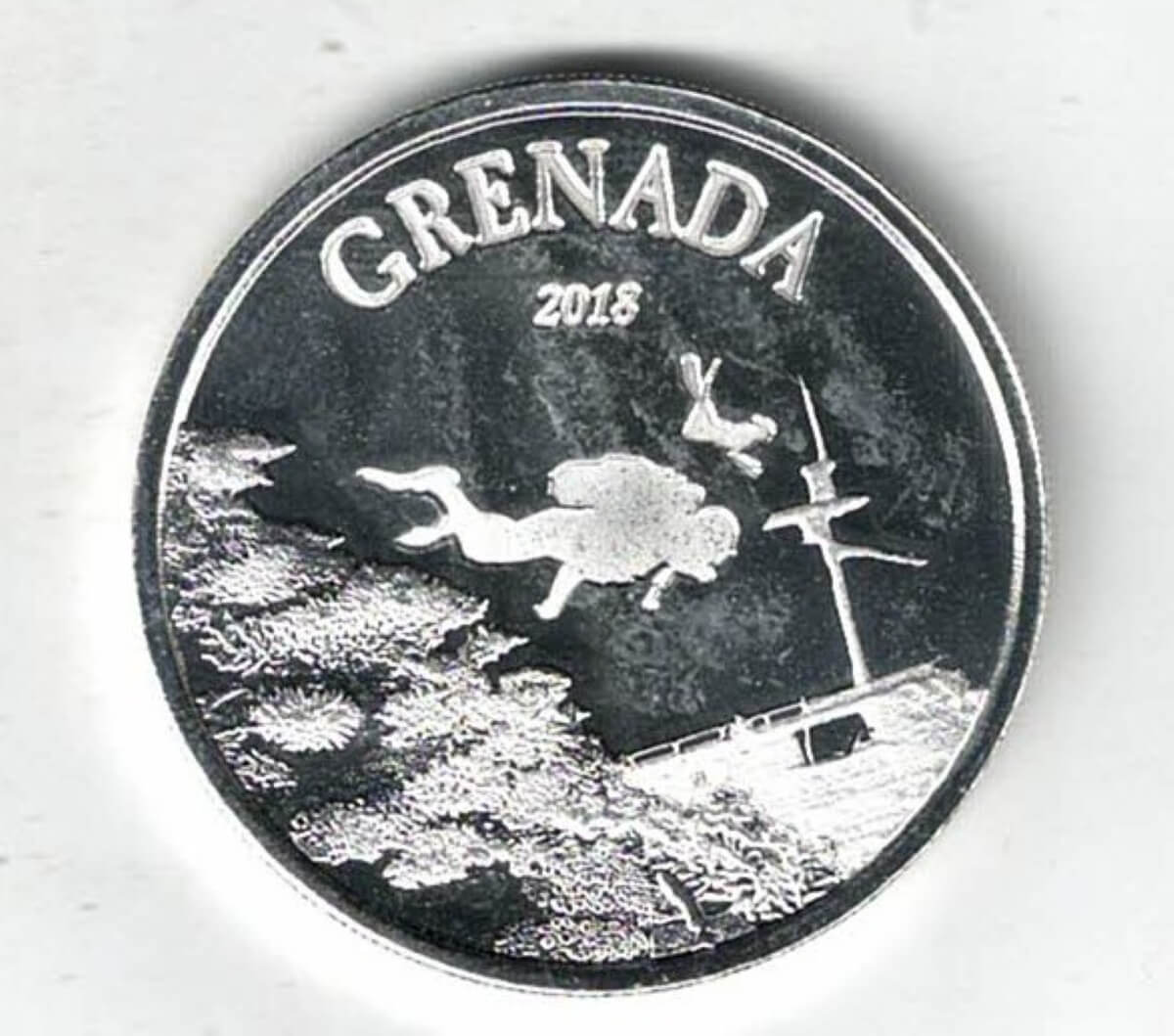 2018 Silver Grenada One Ounce Diving Paradise Coin. Elizabeth II is on the obverse, The Reef Octopus is on the reverse side of the coin.