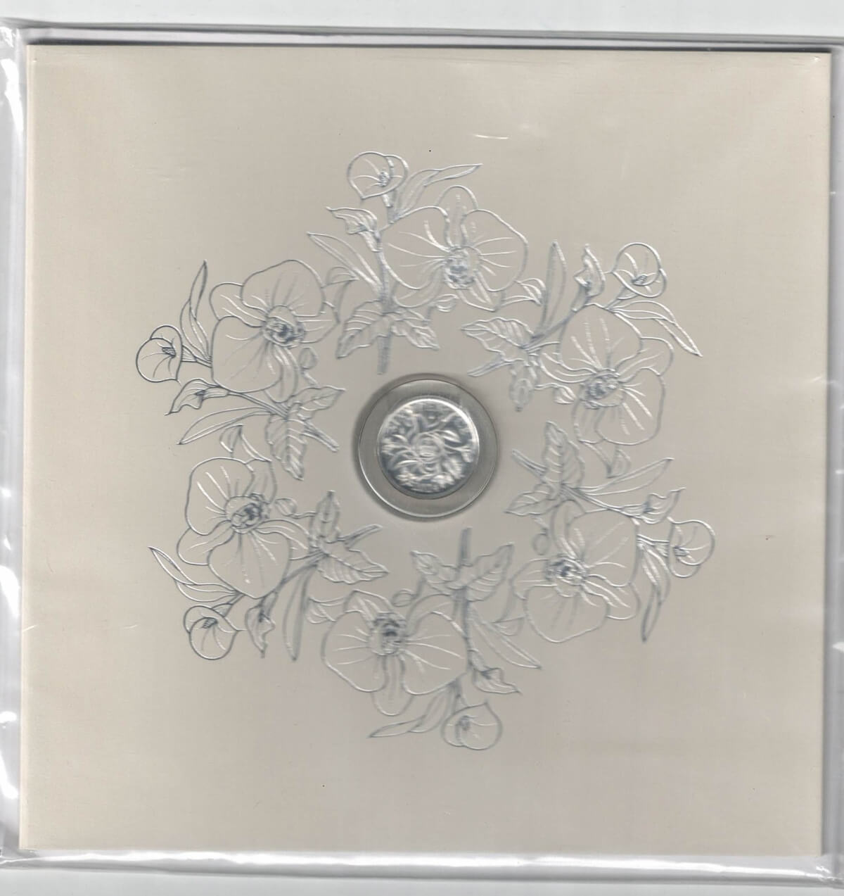 Sealed 2024 Royal Mint Silver Sixpence Coin. The reverse features the portrait of King Charles facing left. The reverse features a Tudor crown with flowers.