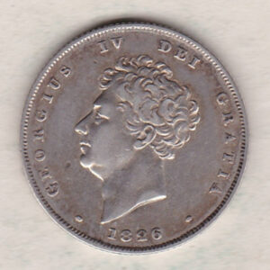 1826 silver shilling coin featuring King George IV on the Obverse. The Reverse has a crowned lion, legend around, national flower emblems below.