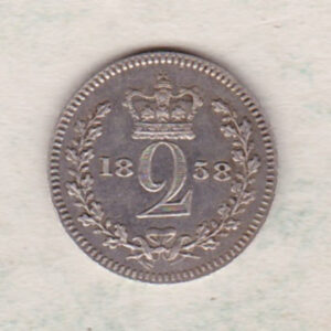 1858 Silver Maundy Twopence coin featuring Queen Victoria on the obverse. A crowned denomination dividing the date on the reverse.