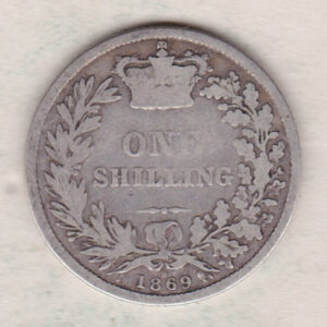 1869 silver shilling coin featuring Queen Victoria young head on the Obverse. The Reverse has a crown, laurel and oak leaves within an open wreath.