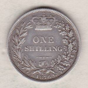 1876 silver shilling coin featuring Queen Victoria young head on the Obverse. The Reverse has a crown, laurel and oak leaves within an open wreath.