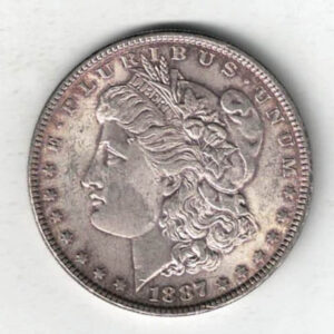 1887 Silver USA Morgan Dollar coin featuring lady liberty on the obverse. The eagle holding arrows and an olive branch on the reverse.