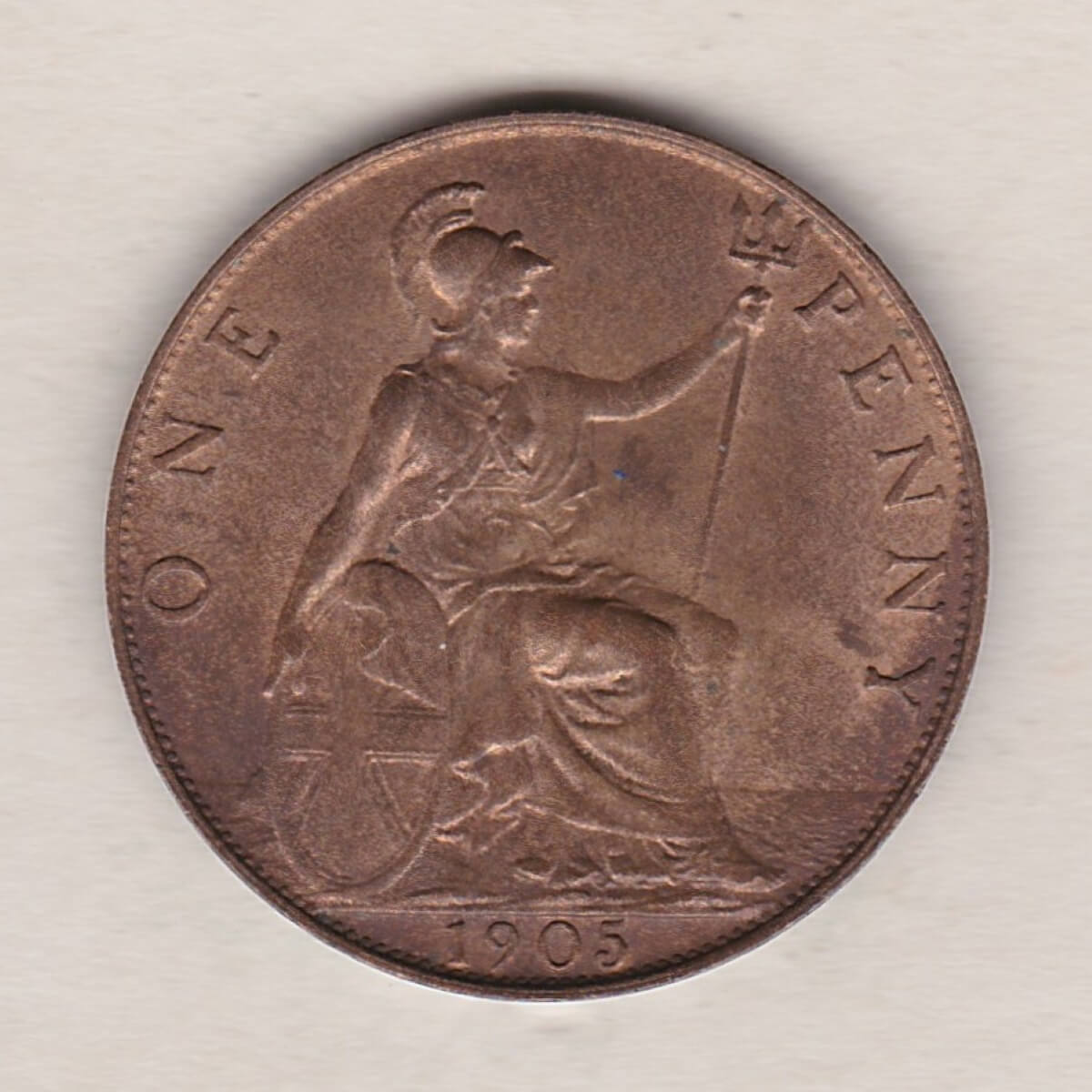 1905 Bronze Penny coin. The obverse features the portrait of King Edward VII. The coin depicts Britannia seated to the right on the Reverse.