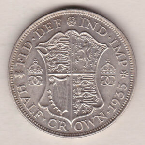 1935 Silver Halfcrown coin featuring the King George V on the Obverse. The Quartered shield of arms flanked by crowned royal cyphers complete the Reverse.
