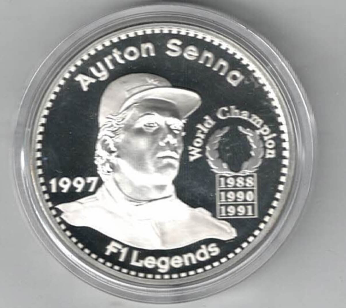 1997 Ayrton Senna Silver Proof Twenty Five Euro Coin. This coin features Ayrton Senna with the championship winning dates.