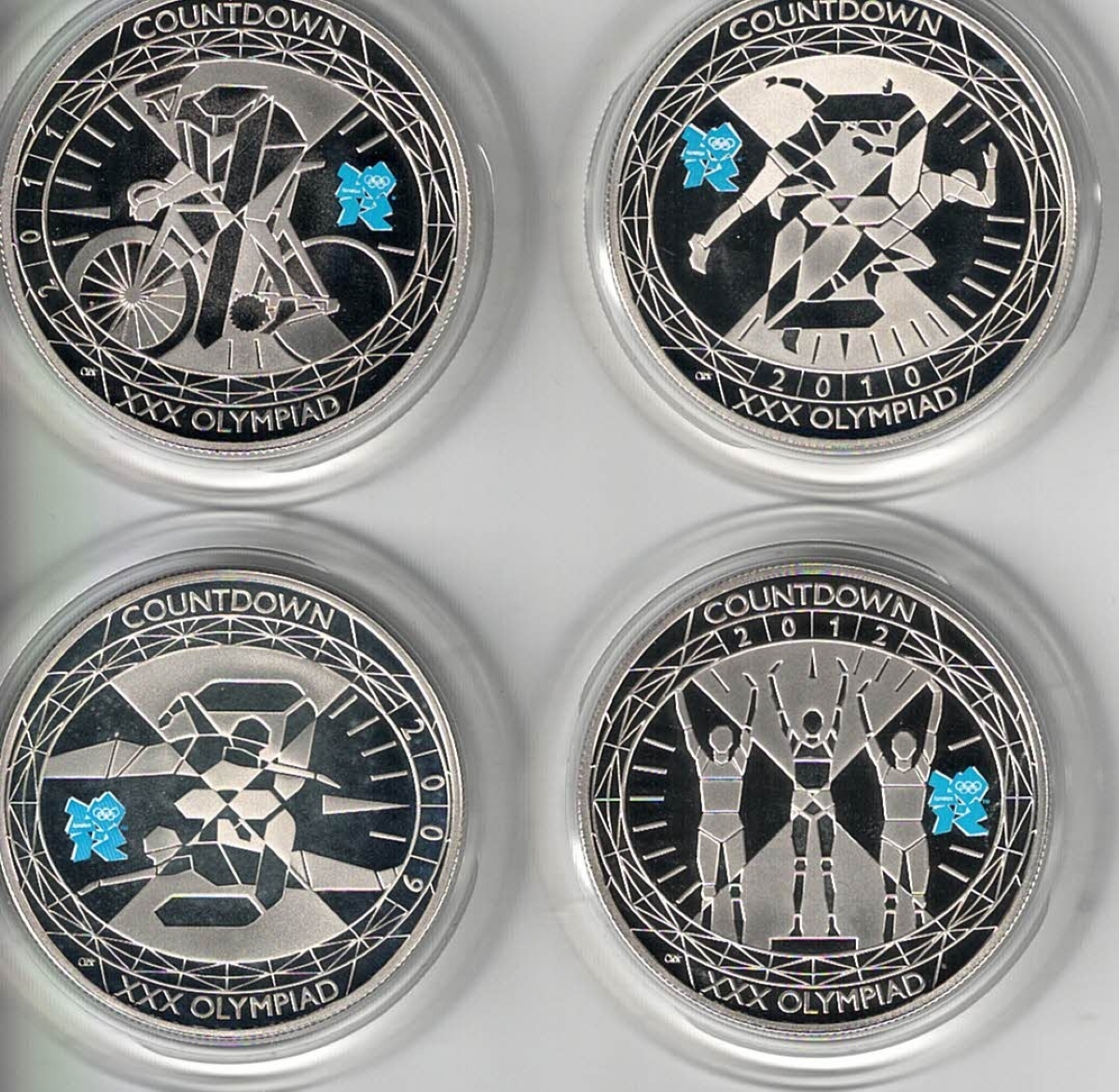 Boxed Countdown To London 2012 Standard proof Five Pound Coin Set. Queen Elizabeth II on obverse. All coins are in stock. You are buying a four coin set.