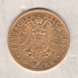 1877 A Germany Gold Five Mark coin featuring the bust of Wilhelm I on the obverse. The crowned imperial eagle on the reverse.