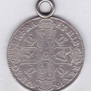 Mounted 1662 silver crown Coin featuring the draped bust of King Charles II on the Obverse and the crowned cruciform of shields on the reverse.