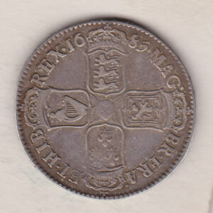 1685 Silver Halfcrown coin. The obverse features King James II. The reverse features the crowned cruciform shields around central Garter star.