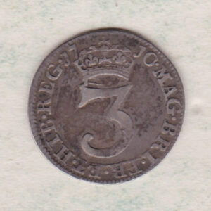 1710 Silver Maundy Threepence coin featuring Queen Anne on the obverse. A central denomination below crown with date divided on the reverse.