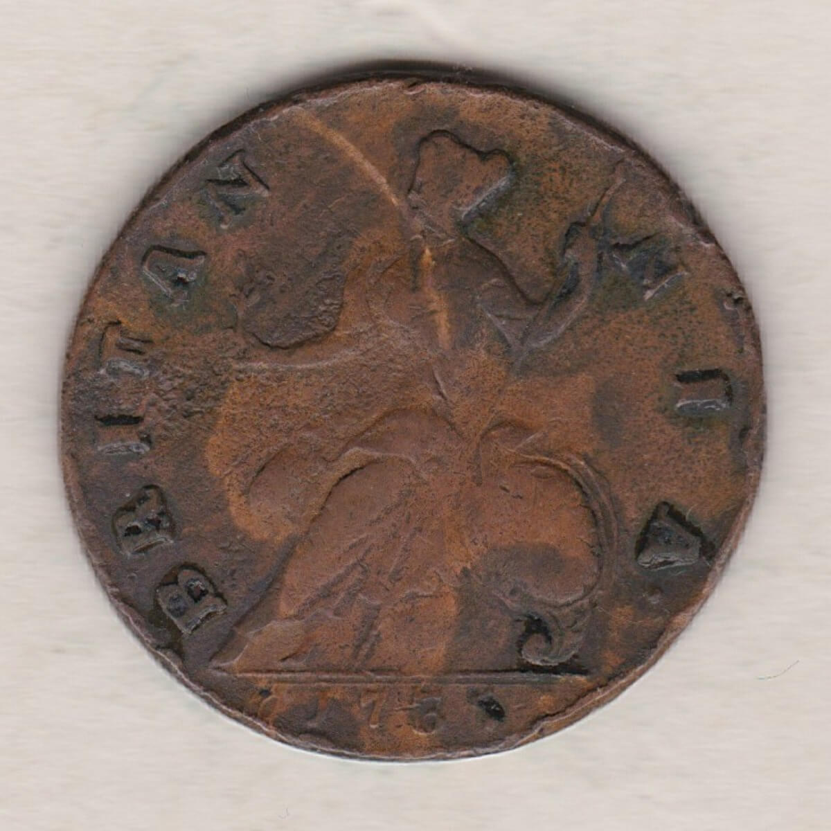 1735 copper halfpenny coin featuring King George II on the Obverse. Britannia seated facing left holding a trident on the Reverse.