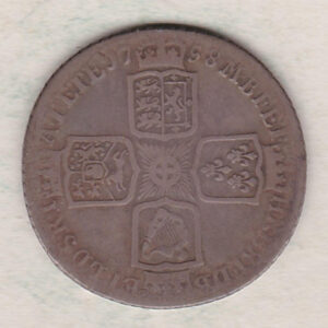 1758 silver shilling coin featuring a laureate and draped bust of George II. The crowned cruciform shields with central Garter star on the Reverse.