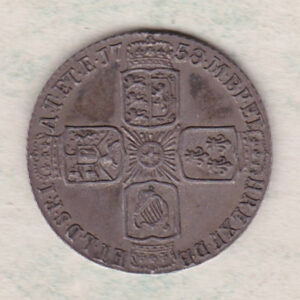 1758 silver sixpence coin featuring a laureate bust of George II. There are four crowned shields arranged in a cross on the Reverse.