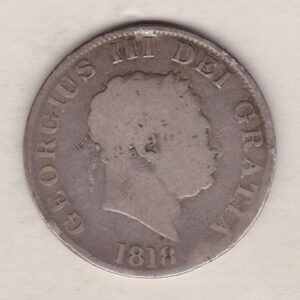 1818 Silver Halfcrown coin with King George III on the Obverse. The reverse features a a crowned and quartered ornate shield of arms.