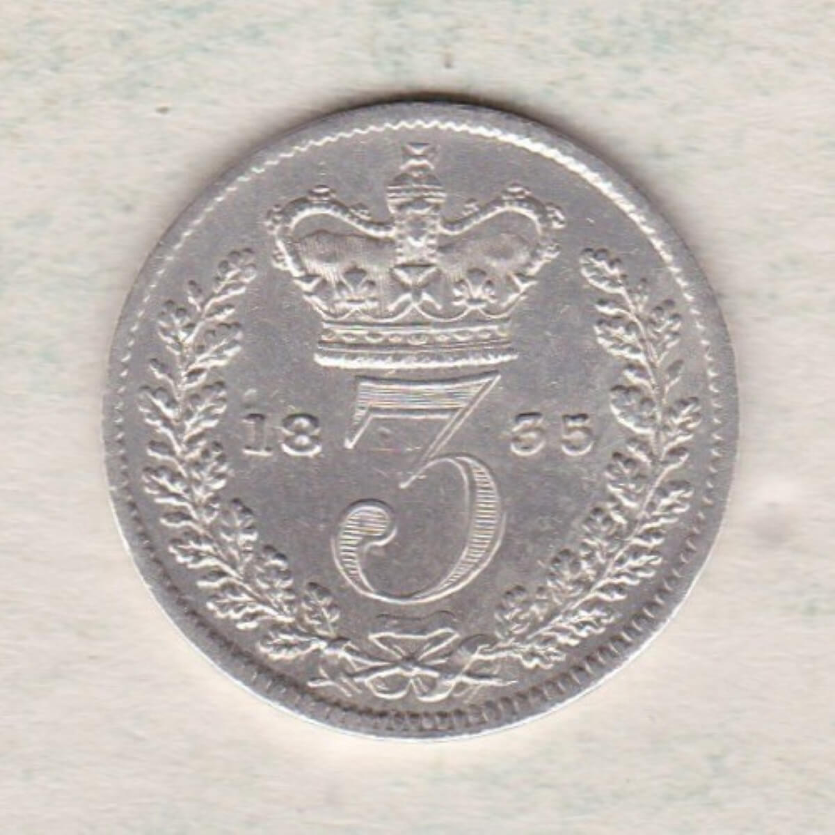 1835 Silver Threepence coin featuring the portrait of King William IV on the Obverse. The Reverse features a crowned denomination dividing the date.
