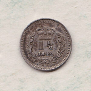 1842 Silver Three Halfpence coin features the portrait of Queen Victoria. The reverse has the crowned denomination above the date within an oak wreath.