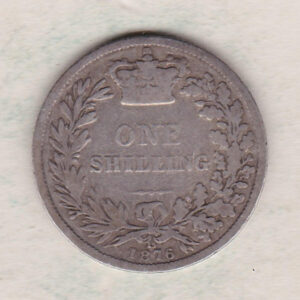 1876 silver shilling coin featuring Queen Victoria young head on the Obverse. The Reverse has a crown, laurel and oak leaves within an open wreath.