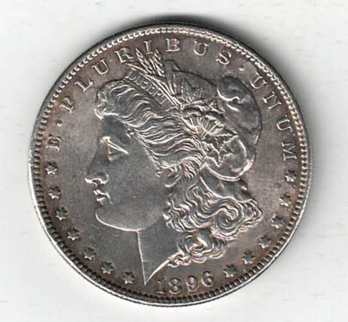1896 Silver USA Morgan Dollar coin featuring lady liberty on the obverse. The eagle holding arrows and an olive branch on the reverse.