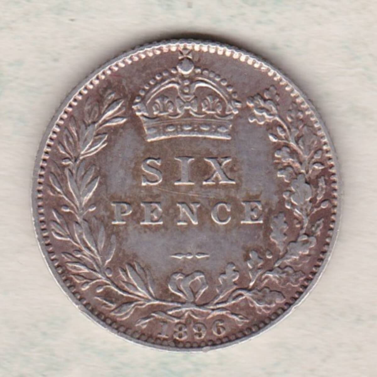 1896 Silver Sixpence coin featuring Queen Victoria on the Obverse. The Reverse features a crowned denomination within wreath.