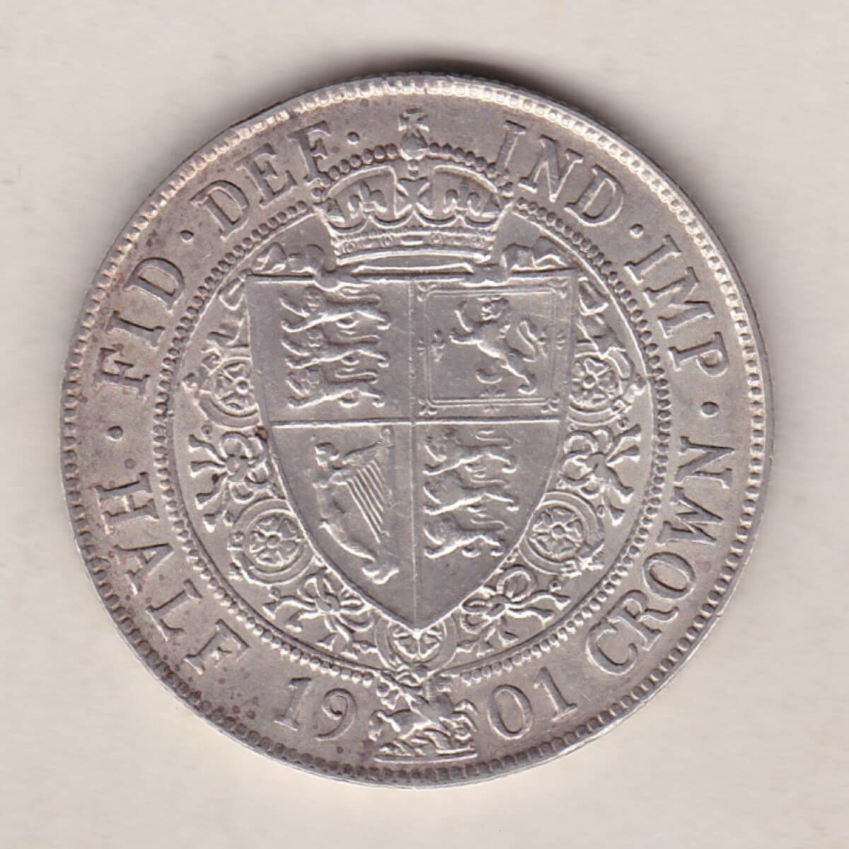 1901 Silver Halfcrown coin featuring the old head of Queen Victoria on the Obverse. The shield of royal arms completes the Reverse design.