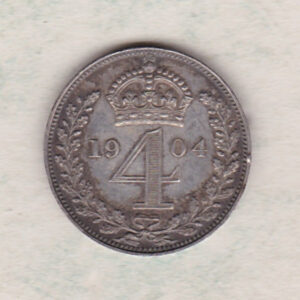 1904 silver maundy fourpence coin featuring king Edward VII on the Obverse. The crowned denomination dividing date within an oak wreath on the Reverse.