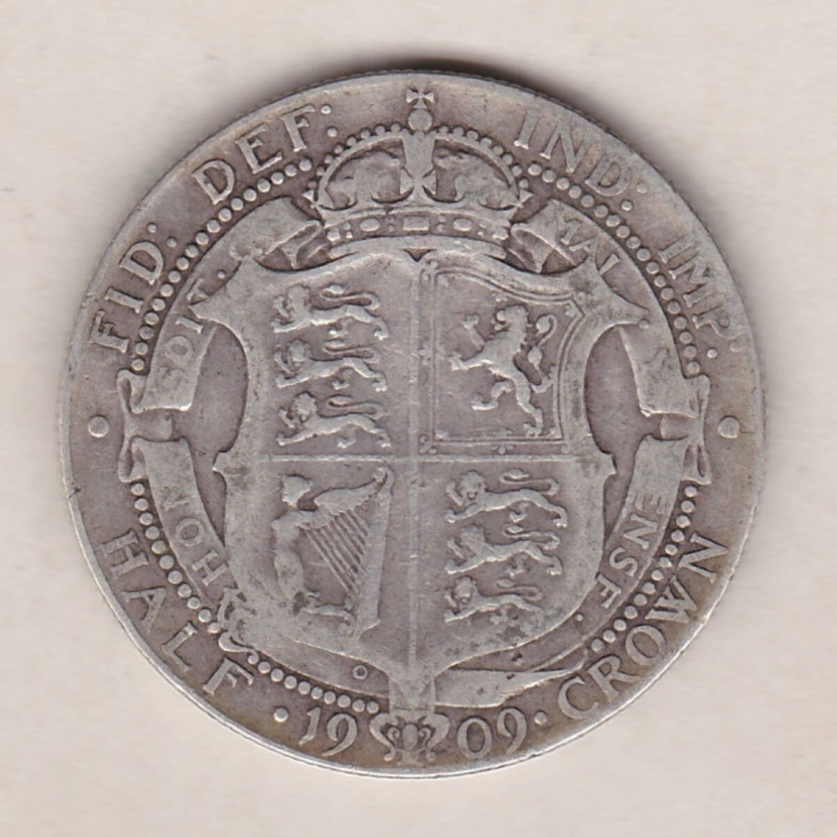 1909 Silver Halfcrown coin featuring king Edward VII on the Obverse. The Reverse features a crowned quartered shield of arms.