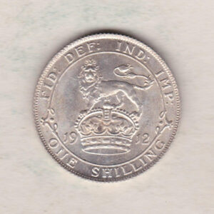 1912 Silver Shilling coin featuring King George V on the Obverse. The Reverse features a crowned lion with date and denomination.