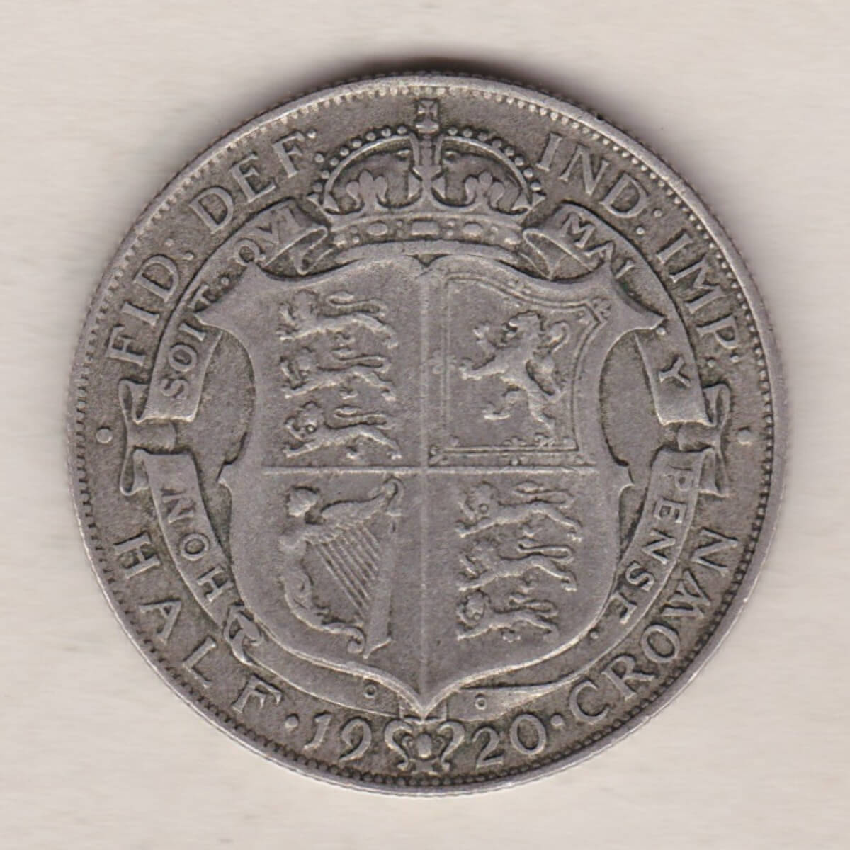 1920 Silver Halfcrown coin featuring the King George V on the Obverse. The crowned quartered shield of arms within Garter band on the Reverse.
