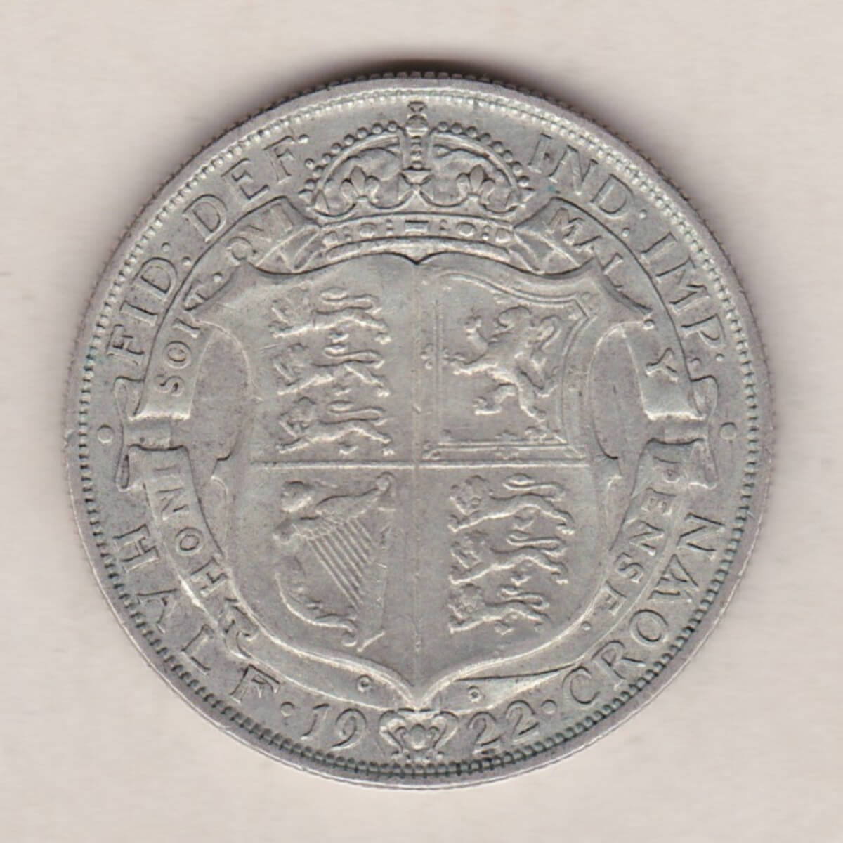 1922 Silver Halfcrown coin featuring the King George V on the Obverse. The crowned quartered shield of arms within Garter band on the Reverse.