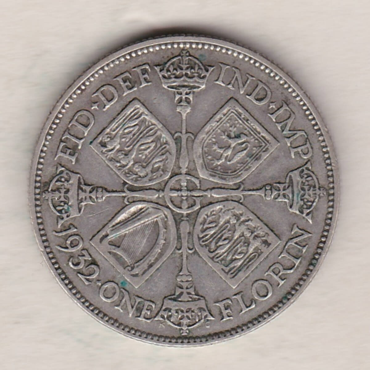 1932 Silver Florin coin. The portrait of King George V on the Obverse. The cruciform crowned sceptres around central G on the reverse.