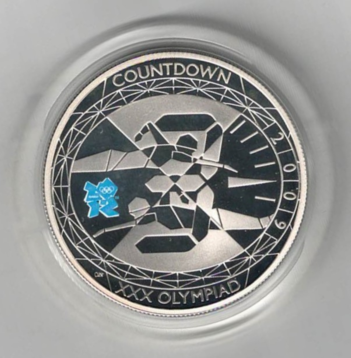2009 Five Pound Silver Piedfort Proof Countdown to London 2012. The reverse features stylized design of swimmers. Obverse features Queen Elizabeth II.