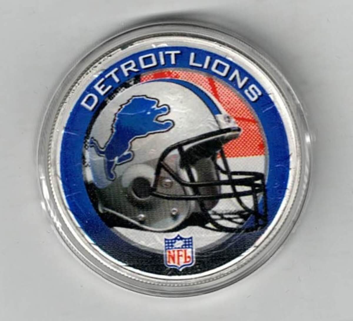 Boxed 2003 Silver USA One Ounce Eagle Colourised NFL Detroit Lions Coin. An eagle is on the reverse. The coin contains one ounce of 999 fine silver