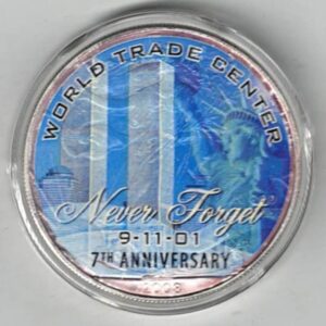 Boxed 2008 Silver USA One Ounce Eagle Colourised World Trade Centre Coin. An eagle is on the reverse. The coin contains one ounce of 999 fine silver.