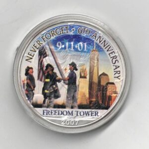 Boxed 2007 Silver USA One Ounce Eagle Colourised Freedom Tower Coin. An eagle is on the reverse. The coin contains one ounce of 999 fine silver.