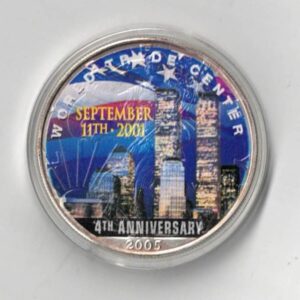 Boxed 2005 Silver USA One Ounce Eagle Colourised World Trade Centre Coin. An eagle is on the reverse. The coin contains one ounce of 999 fine silver.
