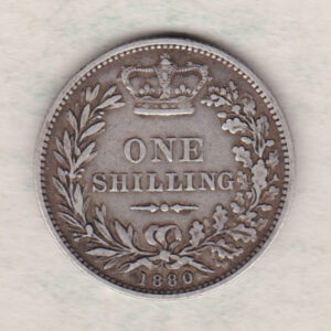 1880 silver shilling coin featuring Queen Victoria young head on the Obverse. The Reverse has a crown, laurel and oak leaves within an open wreath.