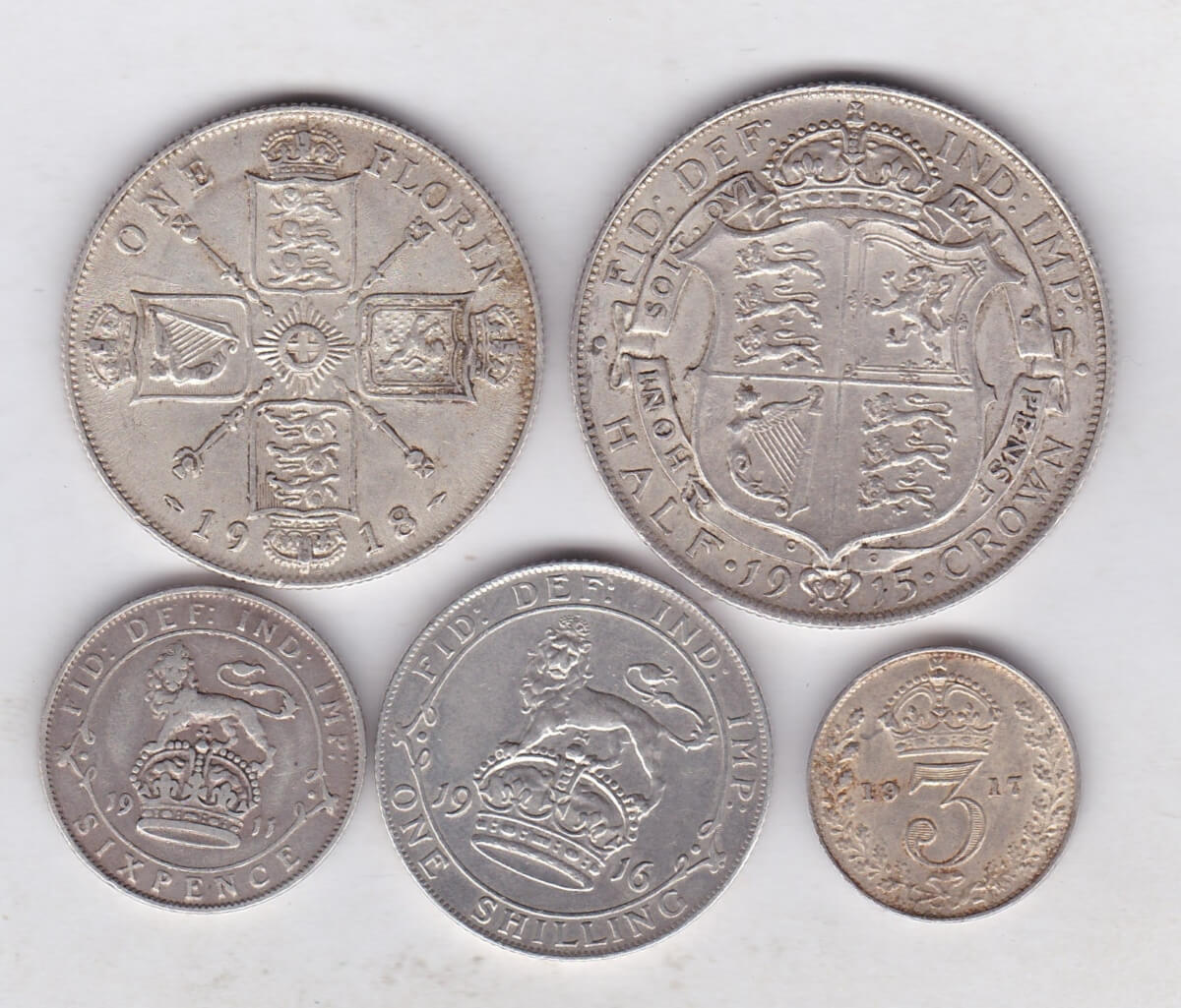 1911 To 1918 Five Coin Silver Selection. The five coins weight approx. 35.16 grams of 0.925 silver. The equivalent of 32.523 grams of fine silver.