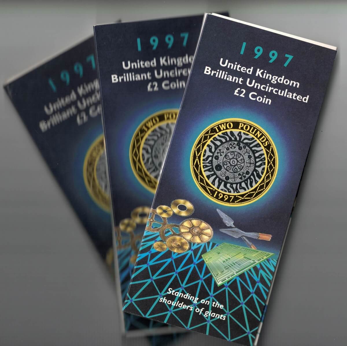 Set of three 1997 Two Pound Coins celebrating technology. Features Queen Elizabeth II on the Obverse. Reverse features four concentric circles representing the Iron Age, Industrial Revolution, silicon chip and the internet.